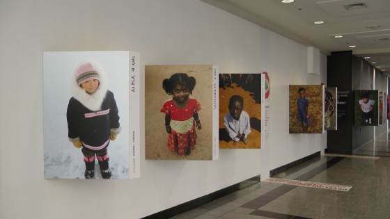 Portraits of children on the top floor of the Eaton Centre.