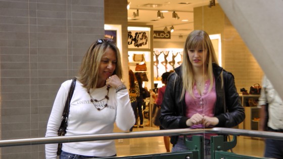 Some shoppers looking at "Fragile" by Roadsworth and Brian Armstrong at the Eaton Centre.