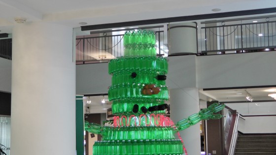 The head of a giant green snowman made out of recycled soda bottles. The head of a giant green snowman made out of recycled soda bottles.