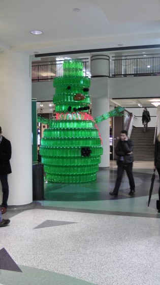 A different perspective on a giant green snowman made out of recycled soda bottles. A different perspective on a giant green snowman made out of recycled soda bottles.