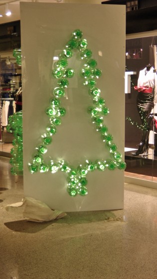 The outline of a Christmas tree made out of recycled soda bottles. The outline of a Christmas tree made out of recycled soda bottles.