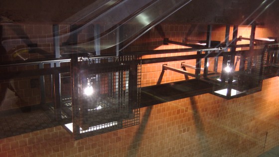 The view of industrial light fixtures from the window.